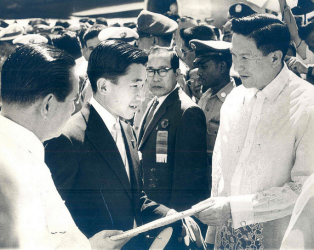 Crown Prince Akihito of Japan is greeted by President Diosdado Macapagal (left) and Vice President Emmanuel Pelaez