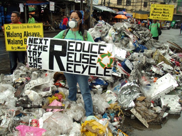 A member of EcoWaste Coalition drives a point with regards garbage disposal aimed at people celebrating New Year's eve. CONTRIBUTED PHOTO/EcoWaste Coalition