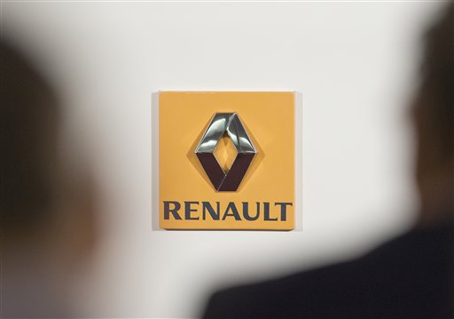 In this Feb. 12, 2015 file photo, the logo of Renault is pictured in Paris. Shares in Renault have dived Thursday Jan.14, 2016 after anti-fraud units conducted raids on the carmaker that unions are reportedly linking to the Volkswagen emissions scandal. AP