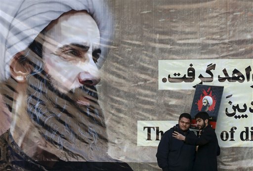 Iranian men take a selfie with a poster of Sheikh Nimr al-Nimr, a prominent opposition Saudi Shiite cleric, who was executed last week by Saudi Arabia, at the conclusion of a rally protesting his execution, in Tehran, Iran, Monday, Jan. 4, 2016. Allies of Saudi Arabia followed the kingdom's lead and began scaling back diplomatic ties to Iran on Monday after the ransacking of Saudi diplomatic missions in the Islamic Republic, violence sparked by the Saudi execution of al-Nimr. (AP Photo/Vahid Salemi)