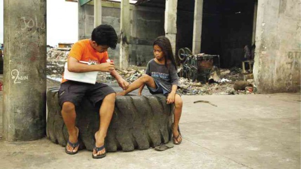 VALDEZ tends to a young girl’s wound.