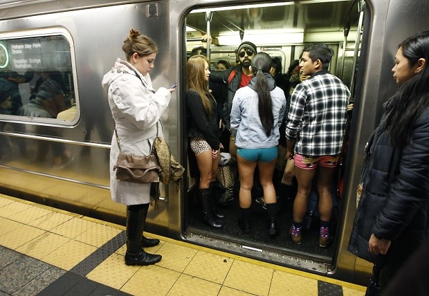 The doors of a subway train open revealing pantless riders in colorful underwear  during the 15th annual No Pants Subway Ride Sunday, Jan. 10, 2016, in New York.  The group event has been going on since 2002. (AP Photo/Kathy Willens)