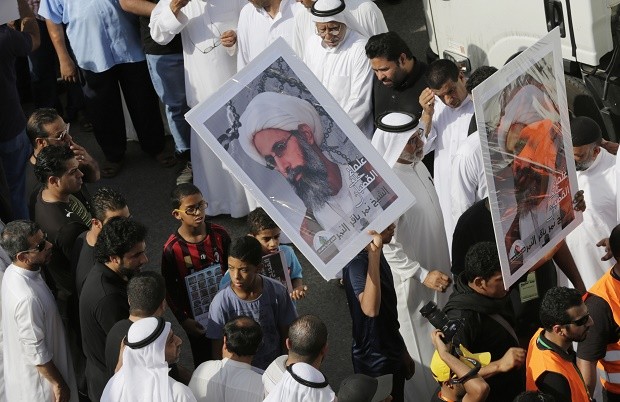 In this Saturday, May 30, 2015, photo, Saudis carry a poster demanding freedom for jailed Shiite cleric Sheikh Nimr al-Nimr, during a funeral procession, in Tarut, Saudi Arabia. Saudi Arabia says it has executed 47 prisoners, including leading Shiite cleric Sheikh Nimr al-Nimr. The cleric’s name was among a list of the 47 prisoners executed carried by the state-run Saudi Press Agency. It cited the Interior Ministry for the information.  (AP Photo/Hasan Jamali)