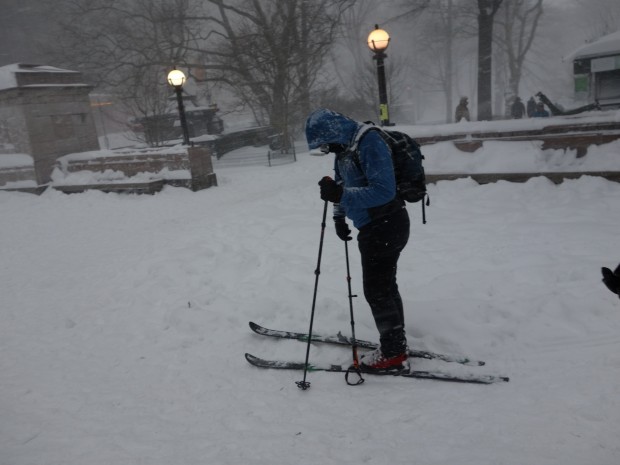 Skier outside entrance to Central Park at Columbus Circle on Saturday afternoon