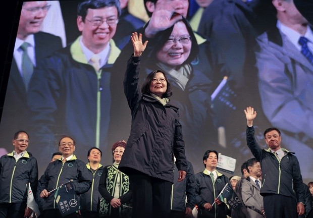 Taiwan's Democratic Progressive Party, DPP, presidential candidate, Tsai Ing-wen, raises her hands as she declares victory in the presidential election Saturday, Jan. 16, 2016, in Taipei, Taiwan. (AP Photo/Vincent Yu)