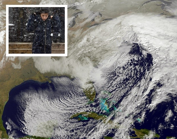 CORRECTS DAY OF WEEK TO SATURDAY, NOT THURSDAY - This image taken by NOAA's GOES-East satellite on Saturday, Jan. 23, 2016, at 9:37 a.m. EST, shows a large winter snowstorm over the East Coast of the United States. (NOAA GOES Project/NASA via AP)