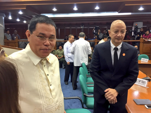 Dismissed PNP chief Alan Purisima (left) and former acting PNP chief Leonardo Espina arrive at the Senate's reopening of the Mamasapano probe. JULLIANE LOVE DE JESUS/INQUIRER.net