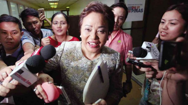 POLL EXEC IN SPOTLIGHT       Comelec Commissioner Rowena Guanzon makes her way to the office of Comelec Chair Andres Bautista for a meeting, following reports of “infighting” in the poll body after Bautista said Guanzon had filed in the Supreme Court an unauthorized comment on pleadings of Sen. Grace Poe to overturn the disqualification decision against her run for the presidency. MARIANNE BERMUDEZ 