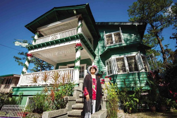 AURORA Peredo-Calaguas, the only surviving child of Roque and Rita Peredo, grew up in this house her parents built from 1914 to 1915. Below is the 100-year-old house’s living room, where the Peredo family built memories in the summer capital.  PHOTOS BY RICHARD BALONGLONG