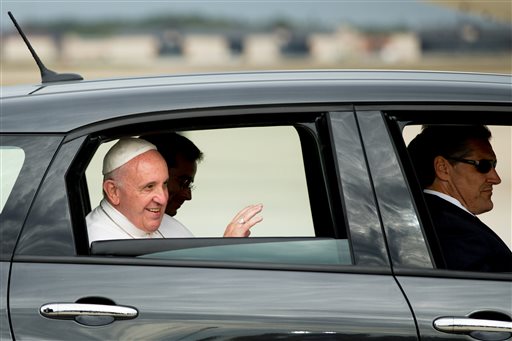 In this Sept. 22, 2015, file photo, Pope Francis waves from a Fiat 500L as his motorcade departs Andrews Air Force Base, Md. ,after being greeted by President Barack Obama and first lady Michelle Obama. One of the two Fiats used by Pope Francis during this visit to Philadelphia last year is going up for auction. The car will be up for bid as part of the Philadelphia Auto Show black tie gala on Jan. 29. Bids will be accepted in person and online. AP FILE PHOTO