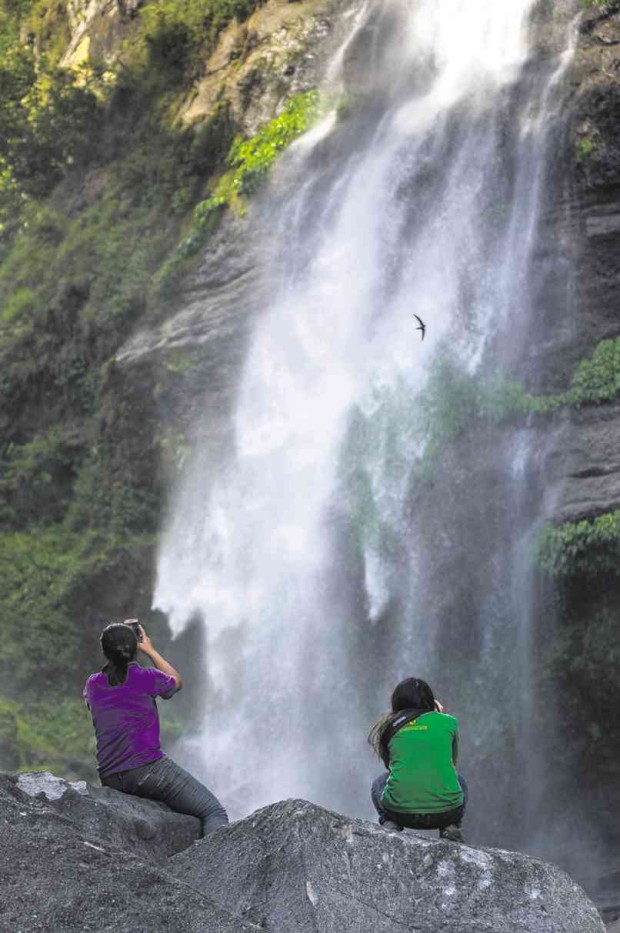 TOURISTS hike for more than an hour from the town center of Sagada to reach the Bomod-ok water falls. RICHARD BALONGLONG