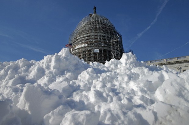 A pile of shoveled snow stands in the plaza on the east side of the U.S. Capitol January 21, 2016 in Washington, DC. One inch of snowfall delayed school openings in the greater Washington, DC, area on Thursday as people along the Easter Seaboard prepare for a blizzard to arrive within the next 24 hours.   AFP PHOTO