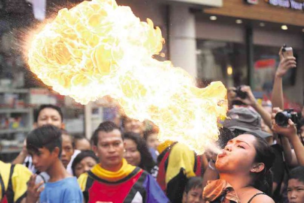 HOT LIPS Not just mythical dragons breathed fire during Monday’s festivities in Binondo, Manila. MARIANNE BERMUDEZ