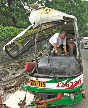 FOUR DIED HERE On Aug. 12, 2015,  a Bulacan-bound Valisno passenger bus hit a concrete post that used to serve as the boundary marker between Quezon City and Caloocan City, leaving four people dead. The driver later tested positive for drugs. Inquirer photo 