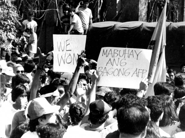 PEOPLE POWER EDSA 1 / FEBRUARY 1986 / SAVED IN PDI ARCHIVE People celebrate after the EDSA revolution. An estimated one to three million people filled EDSA from Ortigas Avenue all the way to Cubao to support Enrile and Ramos against the Marcos administration. These people were armed only with prayers, rosaries, and statues of Mother Mary.  PDI PHOTO