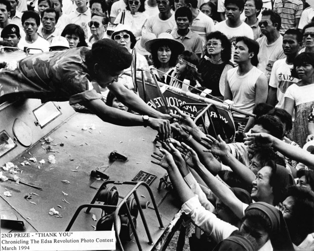 EDSA REVOLUTION / FEBRUARY 1986 Catholic nuns and supporters of the EDSA People Power Revolution greet a soldier on board his V-150 armored tank at EDSA. PDI PHOTO/BOY CABRIDO