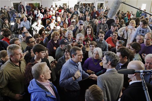 Republican presidential candidate, Sen. Ted Cruz, R-Texas, (foreground center) mingles with audience members after a town hall-style campaign event, Sunday, Feb. 7, 2016, in Peterborough, N.H. (AP Photo/Elise Amendola)