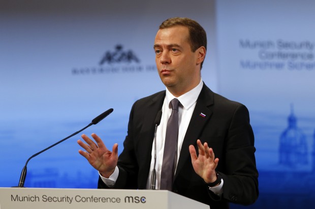 Russian Prime Minister Dmitry Medvedev gestures during his speech on the podium at the Security Conference in Munich, Germany, Saturday, Feb. 13, 2016. (AP Photo/Matthias Schrader)