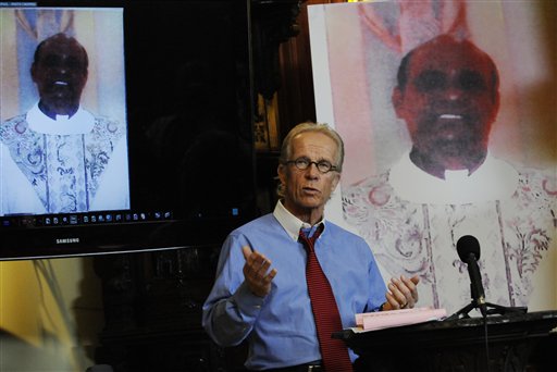 In this Monday, April 5, 2010 file photo, attorney Jeff Anderson stands between photos of The Rev. Joseph Palanivel Jeyapaul during a news conference in St. Paul, Minn.. The Roman Catholic church in southern India has lifted the suspension of Rev. Joseph Palanivel Jeyapaul convicted last year of sexually assaulting a 14-year-old girl in the United States more than a decade ago, a spokesman said Saturday Feb. 13, 2016. (AP Photo/Jim Mone, File)
