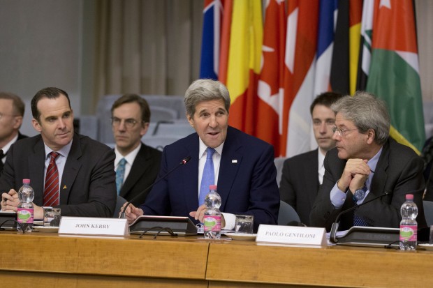 U.S. Secretary of State John Kerry, center, is flanked by special presidential envoy to the U.S.-led coalition against the Islamic State group, Brett McGurk, left, and Italian Foreign Minister Paolo Gentiloni, during a 23-nation conference, in Rome, Tuesday, Feb. 2, 2016. Nations fighting the Islamic State are discussing how to prevent the group from gaining a stranglehold in Libya, though no one is resolved yet to launch a second military intervention in the North African country this decade. (AP Photo/Andrew Medichini)