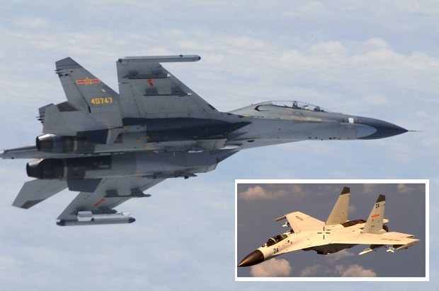 In this undated photo released by Japan Ministry of Defense, Chinese SU-27 fighter plane is shown. China and Japan are blaming each other for a close encounter between military jets over the East China Sea. China's defense ministry says Japanese F-15 fighters followed a Chinese TU-154 plane on regular patrol Wednesday, June 11, 2014 and got as close as 30 meters (100 feet). Japanese Defense Minister Itsunori Onodera said Wednesday that two Chinese SU-27 fighters had posed a danger to Japanese aircraft by flying near them. (AP Photo/Japan Ministry of Defense)