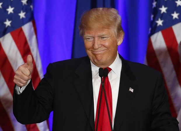 Republican presidential candidate Donald Trump gives a thumbs up during a South Carolina Republican primary night event in Spartanburg, S.C., Saturday, Feb. 20, 2016. Trump claimed a big victory in South Carolina's Republican primary Saturday, deepening his hold on the party's presidential field as the contest moved into the South. (AP Photo/Paul Sancya)