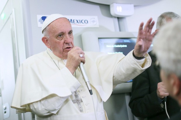 In this photo taken Wednesday, Feb. 17, 2016 Pope Francis meets journalists aboard the plane during the flight from Ciudad Juarez, Mexico to Rome, Italy. The pope has suggested that women threatened with the Zika virus could use artificial contraception but not abort their fetus, saying there's a clear moral difference between aborting a fetus and preventing a pregnancy. (Alessandro Di Meo/Pool Photo via AP)