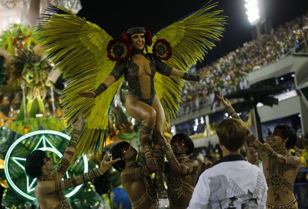 Performers from the Mocidade samba school parade during carnival celebrations at the Sambadrome in Rio de Janeiro, Brazil, Monday, Feb. 8, 2016. (AP Photo/Silvia Izquierdo)