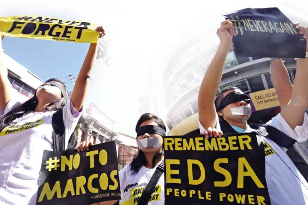  MEMBERS of the militant Akbayan youth group tape their mouths and wear blindfolds to symbolize the stifling of protests during martial law at a rally in Cebu City to commemorate the 30th anniversary of the Edsa People Power Revolution on Feb. 25. JUNJIE MENDOZA/CEBU DAILY NEWS