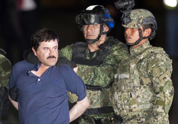 FILE - In this Jan. 8, 2016 file photo, Joaquin "El Chapo" Guzman is made to face the press as he is escorted to a helicopter in handcuffs by Mexican soldiers and marines at a federal hangar in Mexico City, Mexico, following his recapture six months after escaping from a maximum security prison. Guzman's lawyers said Friday, Feb. 19, 2016 he told them that guards at Mexicos Altiplano prison wont let him sleep, and that plans to make a movie about his life with Mexican actress Kate del Castillo are still on. (AP Photo/Eduardo Verdugo, File)