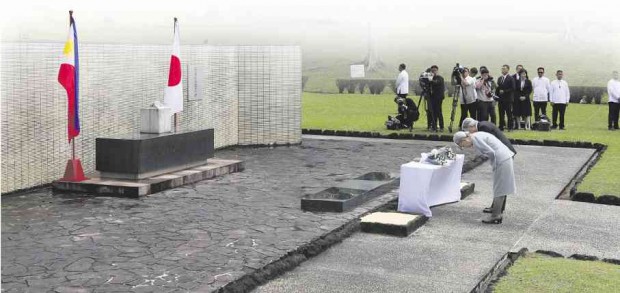 EMPEROR Akihito and Empress Michiko pay their respects to Japan’s war dead at a shrine in the Japanese Garden in Cavinti, Laguna. PHOTOS BY NIÑO JESUS ORBETA