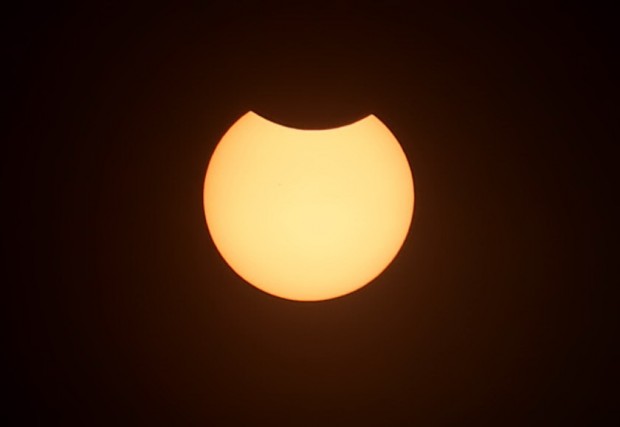 A partial solar eclipse is seen from Gunung Putri, Bogor, West Java, on Wednesday. PJ Leo/The Jakarta Post/ANN