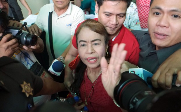UNDER SCRUTINY / MARCH 2, 2016 Dionisia Pacquiao, the mother of Filipino boxing icon Many Pacquiao, leaves the court of tax appeals flank by security escorts after taking the witness stand on Wednesday, March 2, 2016.  The Pacquaio matriarch is under scrutiny on her possible tax liability which started in 2013 at the height of the P2.2 billion tax case against her son. INQUIRER PHOTO / GRIG C. MONTEGRANDE