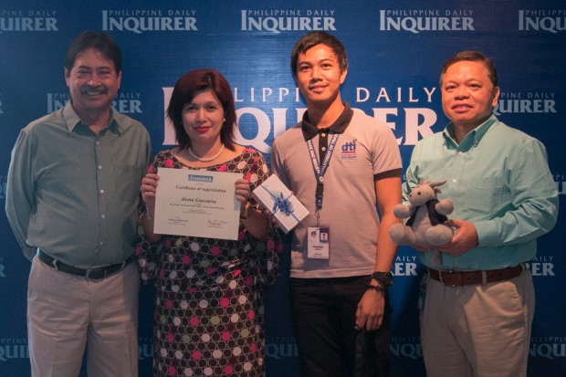 KEEPERS OF THE EDSA FLAME/ MARCH 03 2016                                      (L-R) PDI Executive Editor Joey Nolasco, grand prize winner Alona Guevarra, DTI Representative Marcos Montanez, and IGC chair Ray Soberano at the PDI office for the awarding of the Keeper's of the EDSA Flame contest.  INQUIRER PHOTO/ ALEXIS CORPUZ"