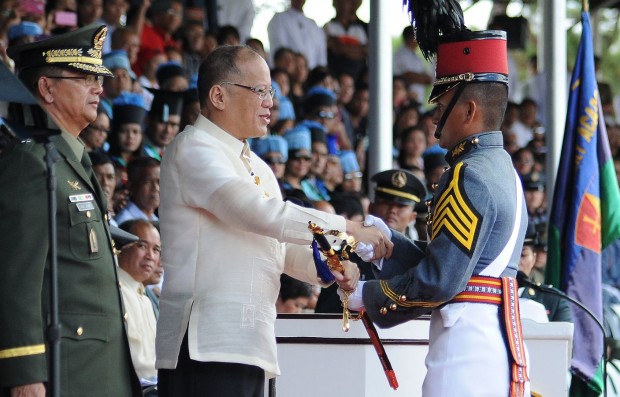 THE SWORD. President Aquino handed this year.s presidential saber to newly-commissioned ensign Kristian Daeve Abiqui, the valedictorian of Philippine Military Academy Gabay Laya Class of 2016. The president led this year's graduation rites at Fort del Pilar. PHOTO BY EV ESPIRITU  