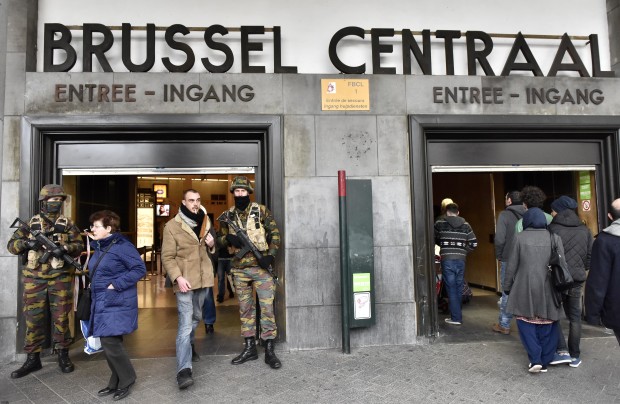 Police secure the central station in Brussels, Wednesday, March 23, 2016. Bombs exploded yesterday at the Brussels airport and one of the city's metro stations Tuesday, killing and wounding scores of people, as a European capital was again locked down amid heightened security threats. (AP Photo/Martin Meissner)