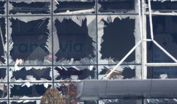 The blown out facade of the terminal is seen at Zaventem airport, one of the sites of two deadly attacks in Brussels, Belgium, Tuesday, March 22, 2016. Authorities in Europe have tightened security at airports, on subways, at the borders and on city streets after the attacks Tuesday on the Brussels airport and its subway system. (AP Photo/Peter Dejong)