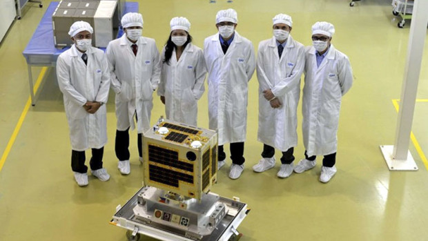 SCIENTISTS from the University of the Philippines and Department of Science and Technology officials turn over Diwata, the first Filipino codeveloped microsatellite, to their counterparts at the Japan Aerospace Exploration Agency in Tsukuba City, Japan. CONTRIBUTED PHOTO