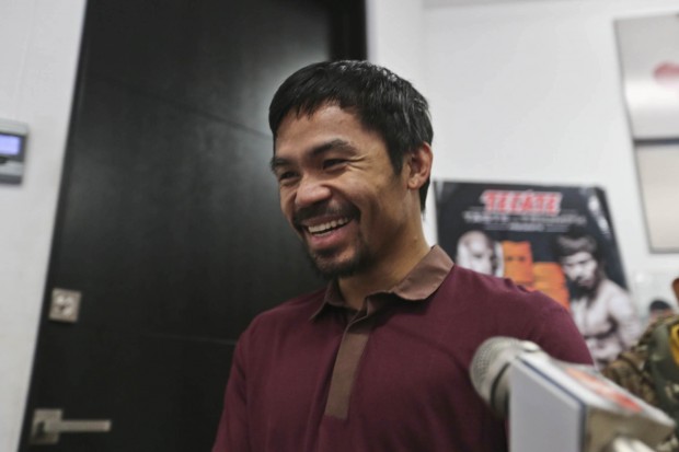Manny Pacquiao smiles to the media during an interview inside his home in Hollywood, CA on Tuesday, 5 May 2015. PHOTO BY REM ZAMORA