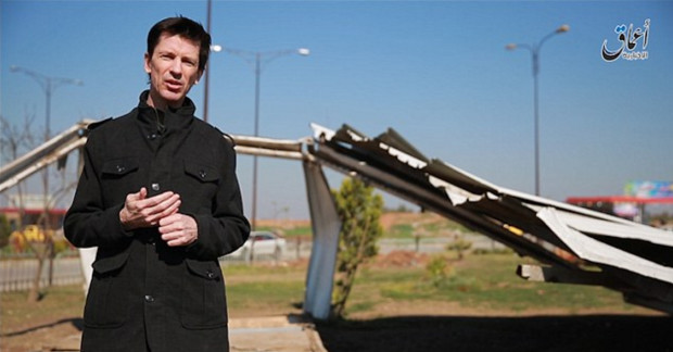 This photo posted online by the Islamic State group-affiliated Amaq News Agency on Friday, March 18, 2016 shows British journalist John Cantlie, who is being held hostage by the militants, during a stand-up for an IS propaganda video in Mosul, Iraq. It is the first video featuring Cantlie to be released by the group since February 2015 when he appeared purportedly from Syria’s Aleppo province. (militant video, Amaq News Agency via AP)