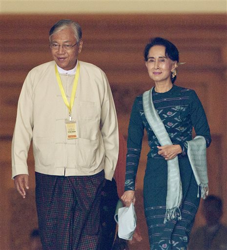 Htin Kyaw, left, newly elected president of Myanmar, walks with National League for Democracy leader Aung San Suu Kyi, right, at Myanmar's parliament in Naypyitaw, Myanmar, Tuesday, March 15, 2016. Myanmar's parliament elected Htin Kyaw as Myanmar's new president Tuesday, a watershed moment that ushers the longtime opposition party of Aung San Suu Kyi into government. (AP Photo/Aung Shine Oo)