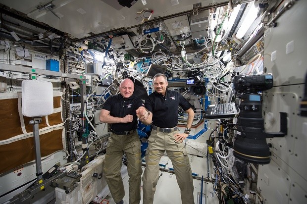 In this Jan. 21, 2016 photo made available by NASA, one-year mission crew members Scott Kelly of NASA, left, and Mikhail Kornienko of Roscosmos their 300th consecutive day in space. The pair will land March 1 after spending a total of 340 days in space. (NASA via AP)
