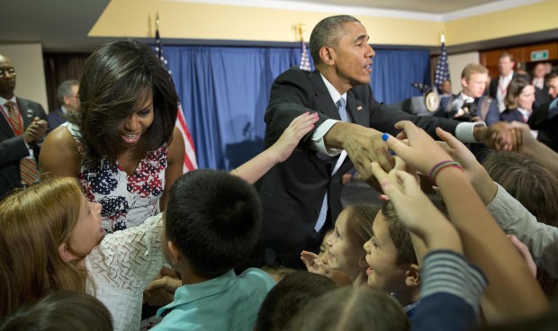 President Barack Obama and first lady Michelle Obama greet children and families of U.S. embassy personnel during an event at the Melia Habana Hotel in Havana, Cuba, Sunday, March 20, 2016. Obama's trip is a crowning moment in his and Cuban President Raul Castro's ambitious effort to restore normal relations between their countries. (AP Photo/Pablo Martinez Monsivais)