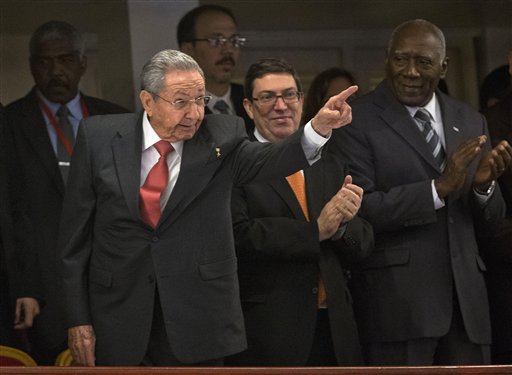 Cuban President Raul Castro points to the front of the stage in anticipation for President Barack Obama's speech at El Gran Teatro de Havana, Tuesday, March 22, 2016, in Havana, Cuba. (AP Photo/Pablo Martinez Monsivais)