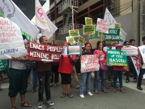 Protesters hold a picket at the office of the DM Consunji Inc. in Makati City, on Mar. 3, 2016, to demand the closure of its nickel mine in Zambales, for allegedly polluting the environment and destroying local livehood. (Photo by Maricar B. Brizuela, INQUIRER)