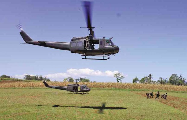HUEY helicopters disgorge more soldiers in Lumbatan town, Lanao del Sur province, as fighting between armed groups—supposedly belonging to the terrorist network Islamic State of Iraq and Syria—continues to rage in the province and other parts of Mindanao. RICHEL V. UMEL/INQUIRER MINDANAO