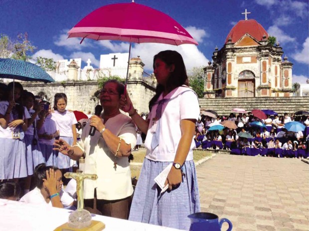 RESIDENTS of San Joaquin, Iloilo province, gather and pray before Campo Santo at the town’s cemetery where suspected treasure hunters dug a hole inside the mortuary chapel in this photo taken from the Facebook page of Fr. Joselito Sarabia.