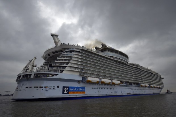 The Harmony of the Seas cruise ship leaves the STX shipyard of Saint-Nazaire, western France, for a three-day offshore test, on March 10, 2016.  With a capacity of 6.296 passengers and 2.384 crew members, the Harmony of the Seas, built by STX France for the Royal Caribbean International, is the world's largest ship cruise.   / AFP / LOIC VENANCE