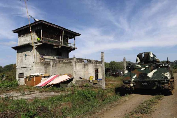 AN ARMY tank enters a camp believed to be used by Moro gunmen who have pledged allegiance to Isis in Butig town, Lanao del Sur province.  JEOFFREY MAITEM/INQUIRER MINDANAO