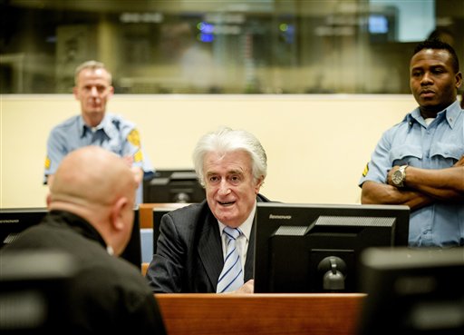 Bosnian Serb wartime leader Radovan Karadzic in the courtroom for the reading of his verdict at the International Criminal Tribunal for Former Yugoslavia (ICTY) in The Hague, The Netherlands Thursday March 24, 2016. The former Bosnian-Serbs leader is indicted for genocide, crimes against humanity, and war crimes. (Robin van Lonkhuijsen, Pool via AP)